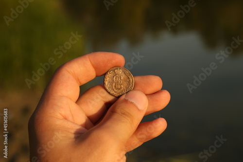 Old Russian Siberian copper coin in hand