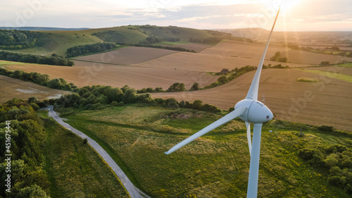 Lonely wind turbine in farm fields, East Sussex, UK.