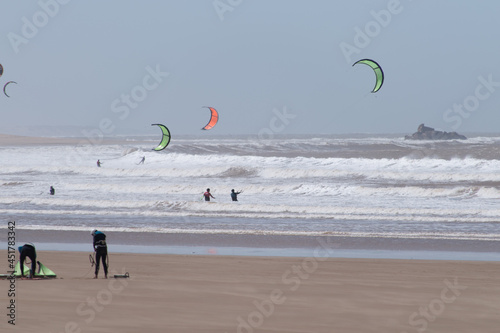 Group of people kitesurfing on the coast of Essaouira, Morocco