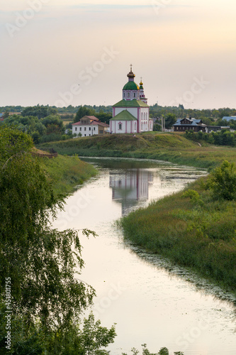 View of Suzdal with Church of Elijah the Prophetl with Kamenka river. Suzdal, Russia 