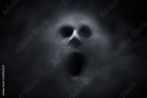 Scary ghost on dark background