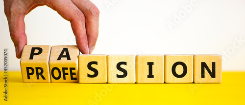 Passion or profession symbol. Businessman turns wooden cubes and changes the word profession to passion. Beautiful yellow table, white background, copy space. Business, passion or profession concept.