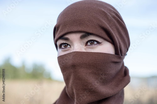 An Afghan woman in a hijab, close-up. The seizure of power. 