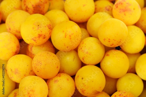 Yellow mirabelle plum fruits closeup, mirabelle fruits background.