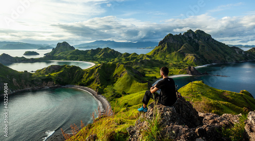A man sitting on the rock on top of Padar island