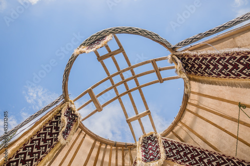 Shanyrak is a wooden crown of a yurt. The yurt is a portable, curved residential building traditionally used by nomads in the steppes of Central Asia as a home.