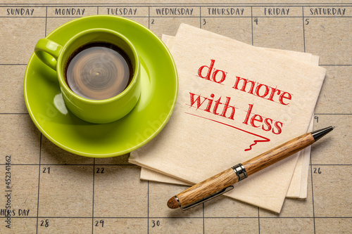 do more with less motivational note on napkin with a cup of coffee, productivity, smart work, business, education and personal development concept