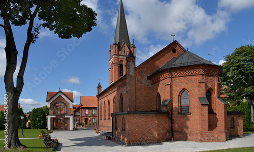 General view and architectural details of the Catholic Church of the Exaltation of the Holy Cross built in 1861 in the neo-Gothic style in the city of Olecko in Masuria, Poland.