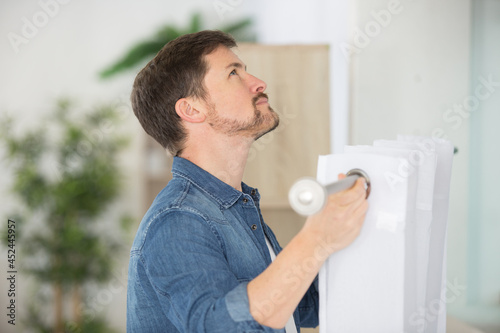 man holding curtains