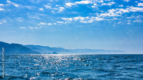 peaceful pacific ocean with puerto vallarta mountains