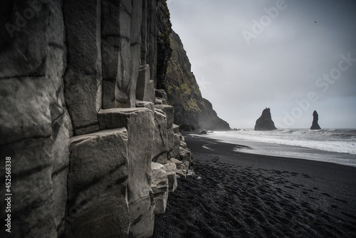 The famous Reyinisfjara black volcanic sand beach with its basalt columns an sea stacks , South Coast, Iceland
