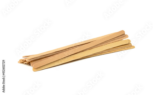 disposable wooden sticks for stirring hot drinks isolated on white background. Coffee and tea spoon, zero waste
