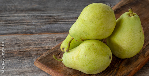 fresh pears on wood background. Copy space