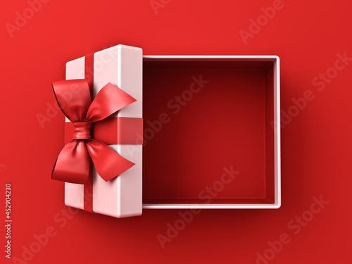 Blank white gift box open or top view of present box tied with red ribbon and bow isolated on red background with shadow minimal conceptual 3D rendering