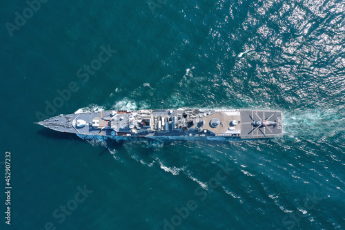 Aerial view of naval ship, battle ship, warship, Military ship resilient and armed with weapon systems, though armament on troop transports. support navy ship. Military sea transport.