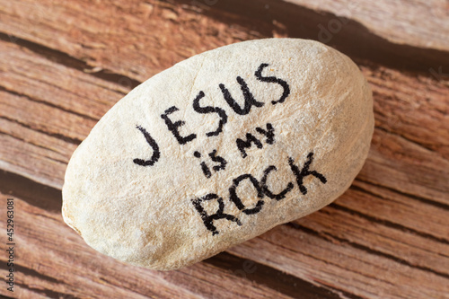 Jesus Christ is my God, Rock, Salvation, Savior, and Deliverer. A handwritten quote from Holy Bible on a stone. A closeup. The Christian biblical concept of trust, faith, hope. 