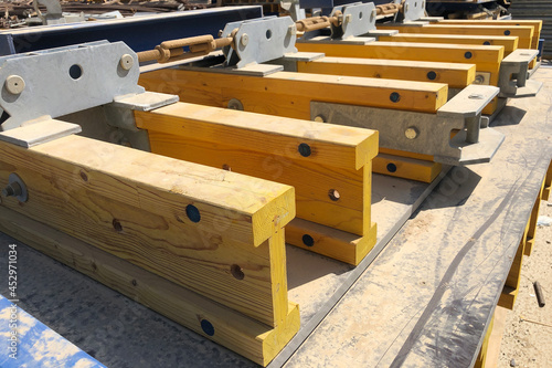 Stacked formwork made of yellow wooden beams using for concrete cast in place works
