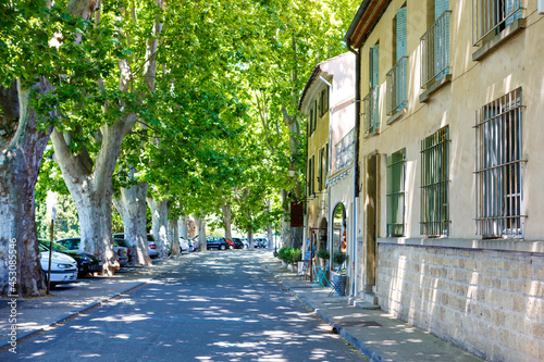 Provencal street with typical houses in southern France, Provence. Aix-en-Provence city on sunny summer day.