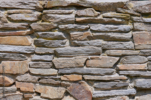 Stone wall built of sandstone in the national park, nature reserve, villages, meadows.