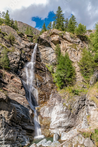 Vertical view of the famous Lillaz Waterfalls, Cogne, Aosta Valley, Italy, on a sunny day