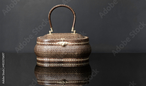 handmade woven bag, wicker bag pattern and taxture brown color. Bag made from nature plants Lygodium. Produced in the southern region thailand.