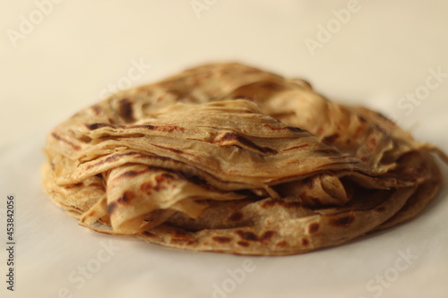 Parotta or Porotta is a layered flatbread made from Maida or Atta, alternatively known as flaky ribbon pancake. It is a favourite food item of Kerala
