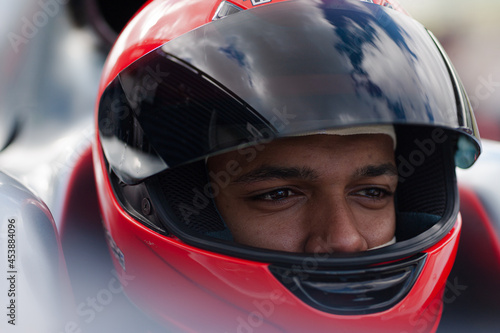 Close up of racer wearing helmet