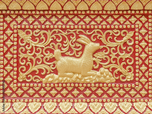 Traditional Thai style stucco or high-relief sculpture of rabbit of 12 Zodiac,on the wall of temple in Thailand