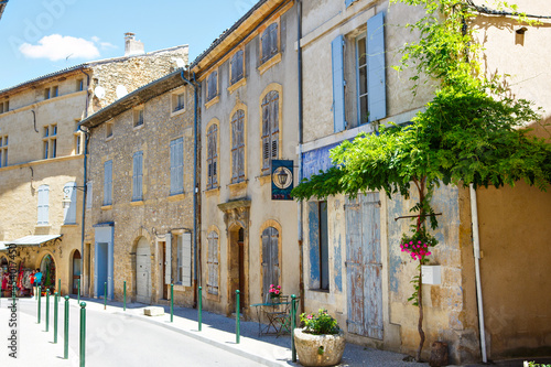 Provencal street with typical houses in southern France, Provence. Aix-en-Provence city on sunny summer day.