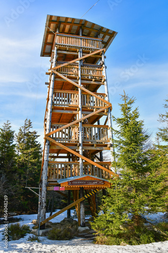 A wooden lookout tower on top of the Czernica Mountain in the Sudetes, winter day.