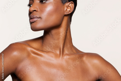 Studio portrait of shirtless beautiful woman