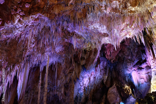 Colored stalactites and stalagmites in the Canalette cave (France)