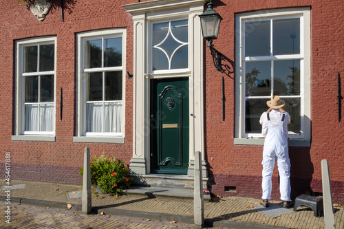 Painter at work in Edam, Noord-Holland province, The Netherlands