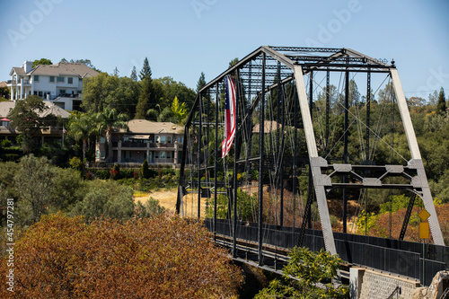 Daytime view of the historic 1893 pedestrian bridge in Folsom, California, USA.