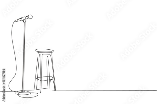 Single continuous line drawing microphone and stool on stand up comedy stage. Equipment at night club or bar for stand up comedian performance. Dynamic one line draw graphic design vector illustration