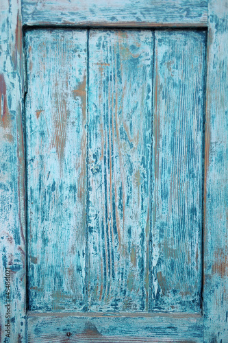 Wycinek ze starych drewnianych cyjanowych drzwi.