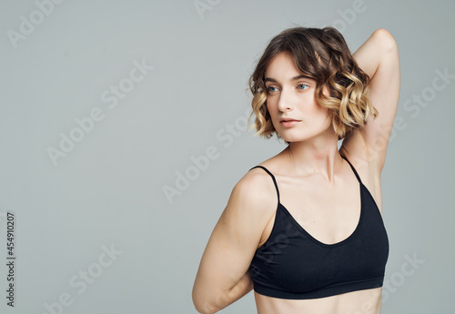 woman in sports uniform exercises isolated background