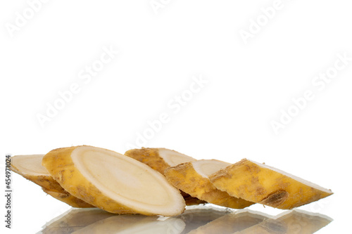 Spicy horseradish root slices, close-up, isolated on white.