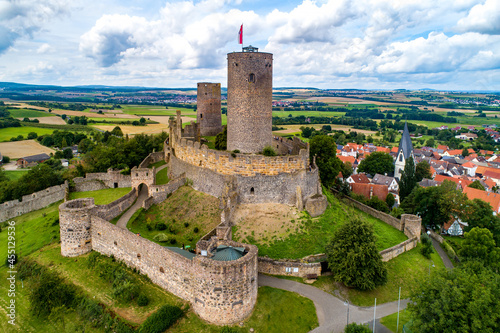 Ruin of medieval Münzenberg castle in Hesse, Germany. Built in12th century, one of the best preserved castles from the High Middle Ages in Germany. Summer, aerial view