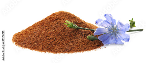 Pile of chicory powder and flower on white background