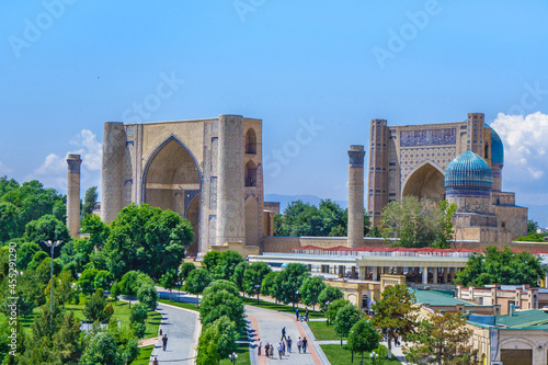 Panorama of Bibi-Khanym mosque complex in Samarkand, Uzbekistan. You can see alley and people walking