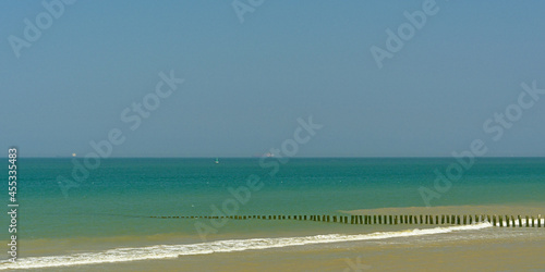 Beach on thre French opal coast with wooden poles as wave breaker