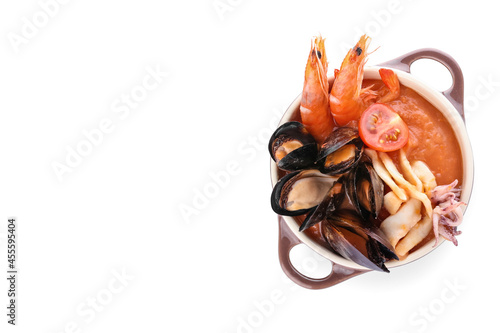 Pot of tasty Cacciucco soup on white background