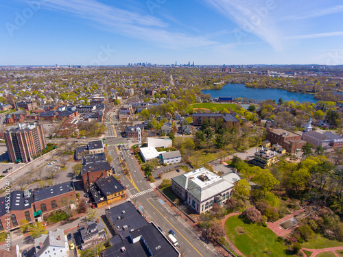 Arlington historic town center aerial view on Massachusetts Avenue at Mystic Street and Broadway with Boston at the background, Arlington, Massachusetts MA, USA. 