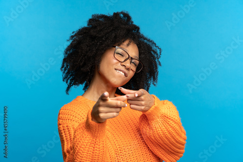 You what we need: excited african woman choosing you and gesturing point fingers front. Happy black female directing to camera, wink and bite lip. Career development, job offer and join team concept