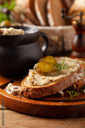 Sandwich with lard and pickled cucumber. Traditionally rendered lard with cracklings and onion.