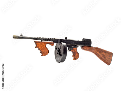 Thompson submachine gun with cartridge magazine isolated on white background.