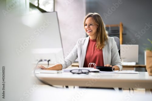 Accountant Women At Desk Using Calculator