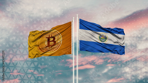 salvador flag and Bitcoin Flag waving over blue sky 
