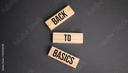 back to basics word written on wood block. objective text on table, concept.